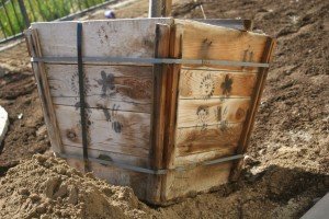 weathered cedar wood container with cool stencils and interesting metal straps