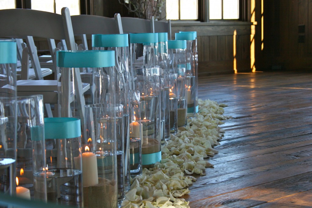 large hurricane vases with candles tiffany blue ribbon white rose petals 