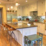 beachy kitchen with darn quartz and blue stacked tile back splash white shaker cabinets