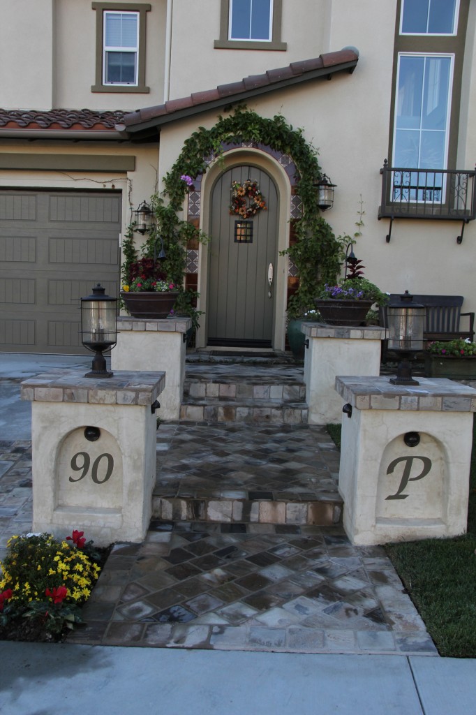 front entry fall scape with arched pilasters