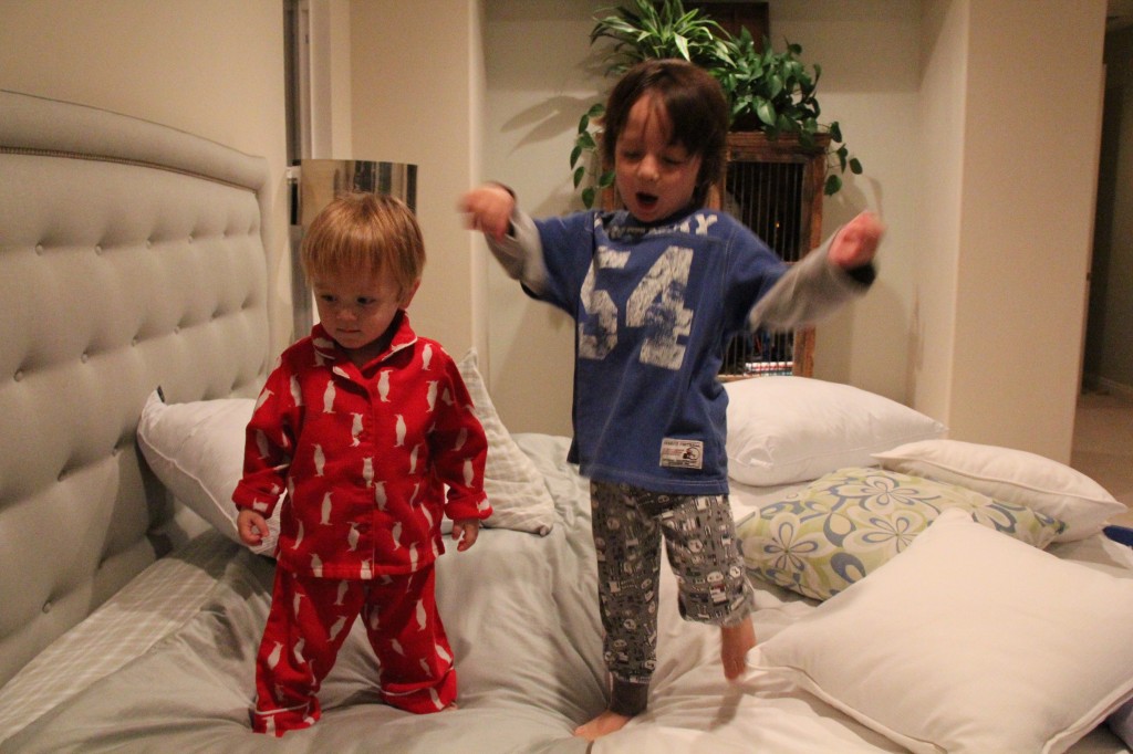 2 little monkeys jumping on the bed