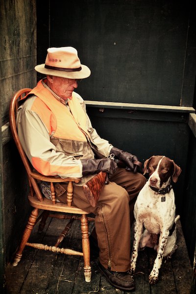 older man with his hunting dog