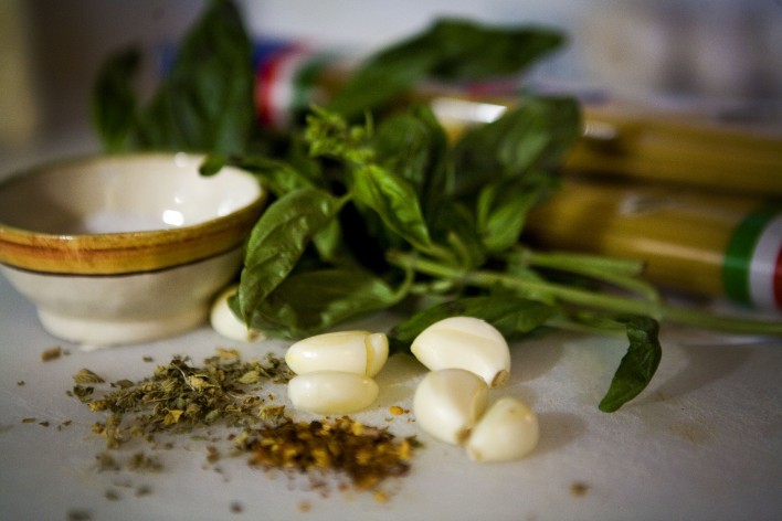 garlic, basil on cutting board