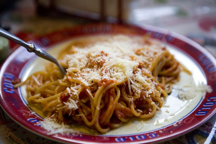 spaghetti topped with parmesan