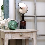 beachy chic side table with sea shells, glass float, and coral