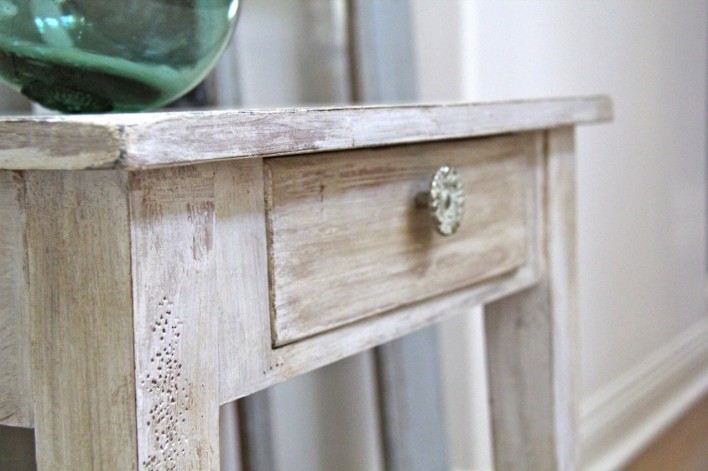 close up detail of shabby chic side table painted with Annie Sloan pure white