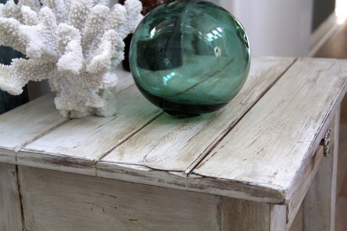 beachy shabby chic side table with green glass float