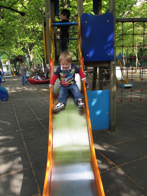 toddler going down slide at Jardin du Luxembourg