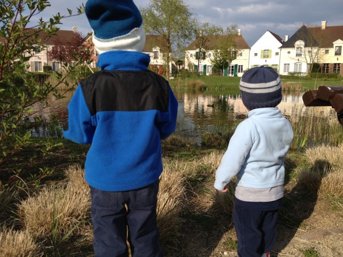 boys looking over a lake