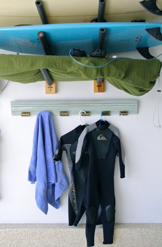 industrial hanging rack with towel, wetsuits