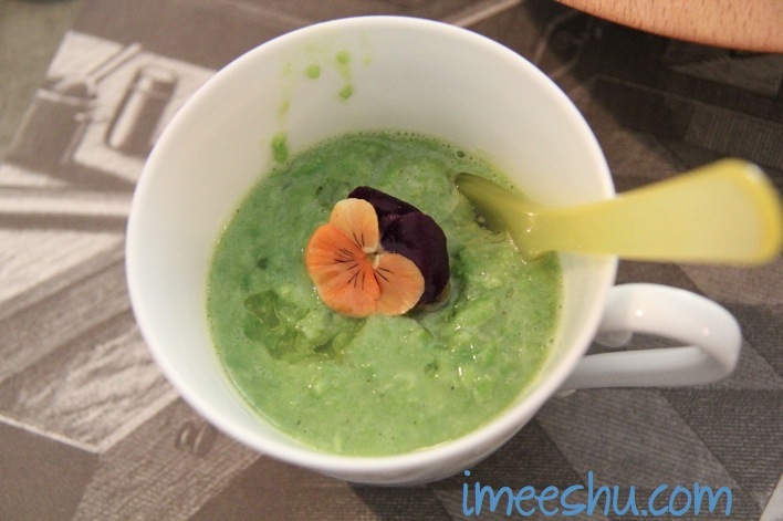 pea soup with pansy flower