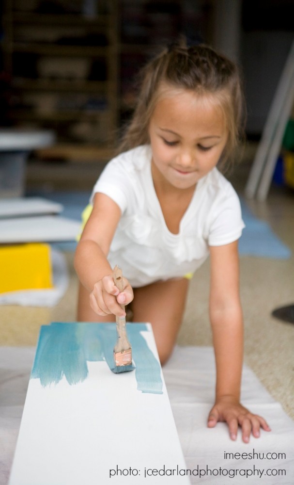 girl painting with Miss Mustard Seed Milk Paint