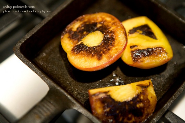 blackened peaches in iron skillet