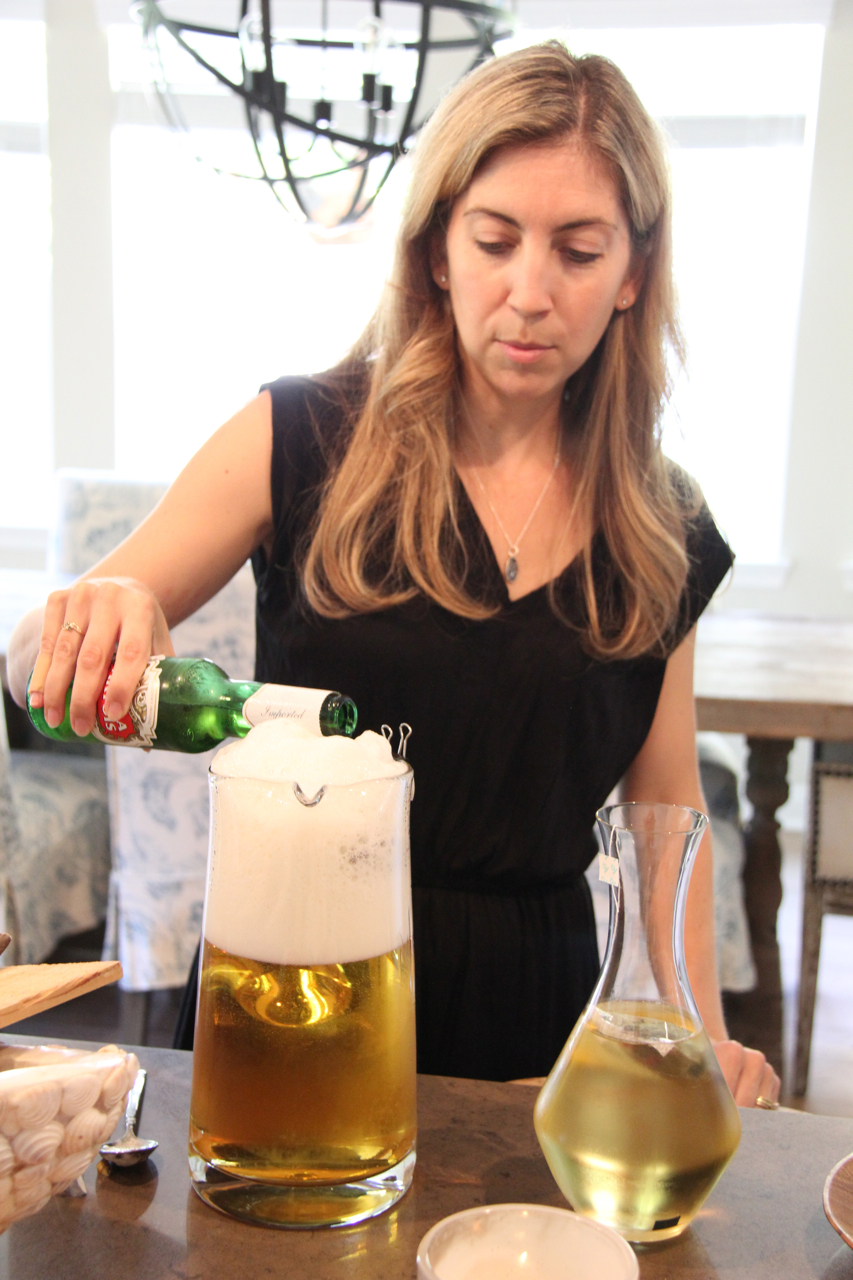 Jen Picotti pouring Stella Artois beer