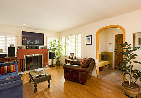 spanish cottage family room with fireplace
