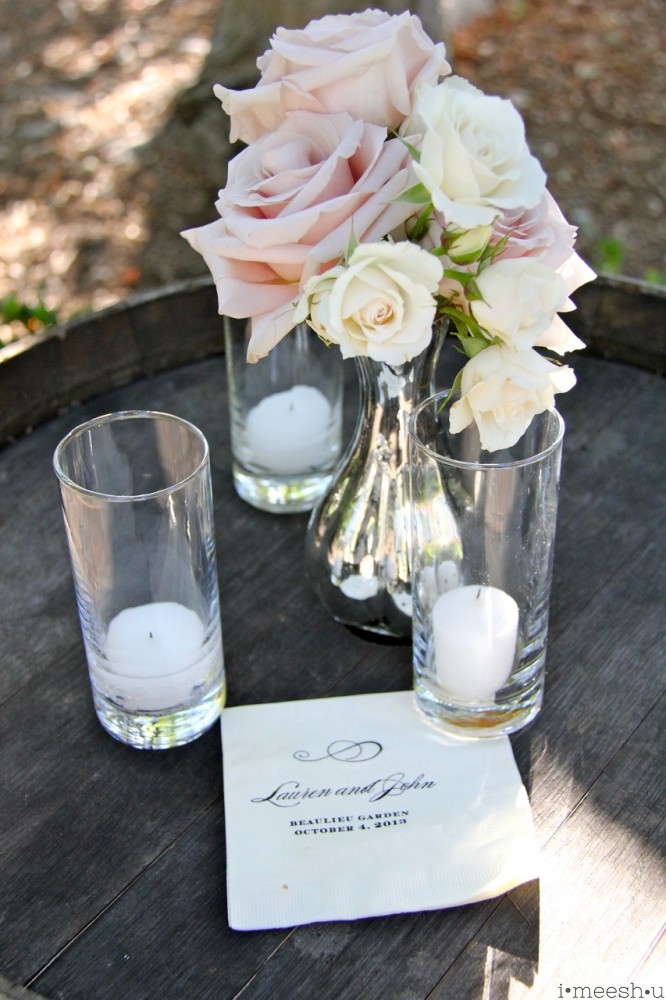 candles and roses on a wine barrel at Napa wedding
