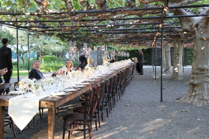 long family style dinner tables at evening wedding setting at Beaulieu Gardens Napa