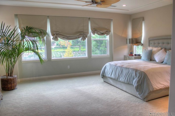 master bedroom with custom roman shades