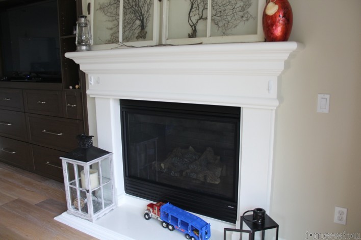 white fireplace mantle with sea fans